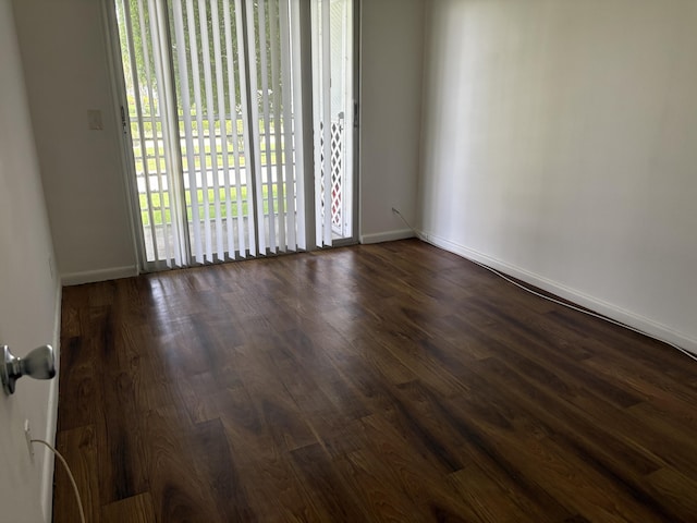 613 Fanshaw O Unit 613O, Boca Raton, FL 33434 - empty room featuring dark wood-type flooring and baseboards