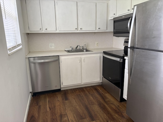613 Fanshaw O Unit 613O, Boca Raton, FL 33434 - kitchen with appliances with stainless steel finishes, light countertops, white cabinetry, and dark wood finished floors