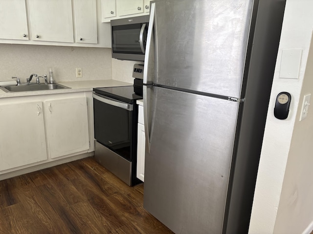 613 Fanshaw O Unit 613O, Boca Raton, FL 33434 - kitchen with appliances with stainless steel finishes, dark wood finished floors, light countertops, and white cabinets