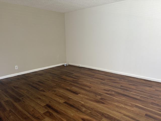 613 Fanshaw O Unit 613O, Boca Raton, FL 33434 - spare room with dark wood-style floors and a textured ceiling