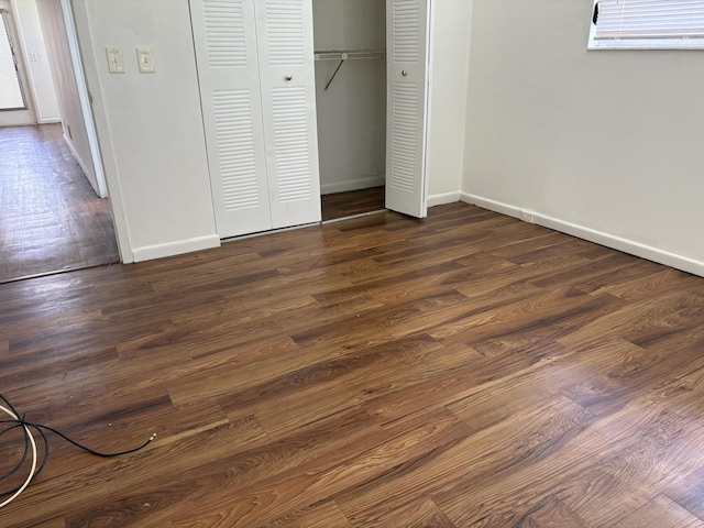 613 Fanshaw O Unit 613O, Boca Raton, FL 33434 - unfurnished bedroom featuring a closet and dark wood-type flooring