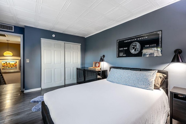 22164 Boca Rancho Dr Unit D, Boca Raton, FL 33428 - bedroom with wood finished floors, a closet, and an ornate ceiling