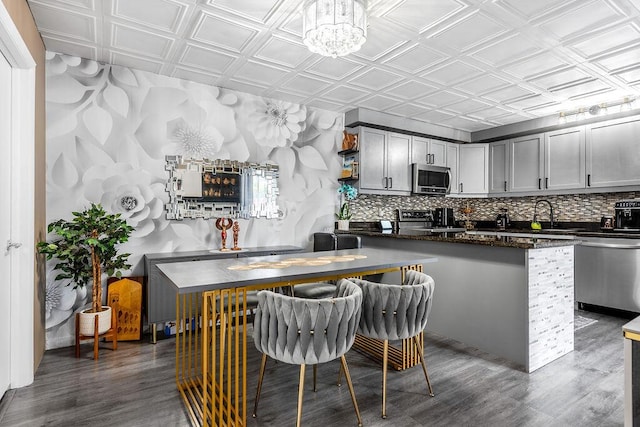 22164 Boca Rancho Dr Unit D, Boca Raton, FL 33428 - kitchen with appliances with stainless steel finishes, an ornate ceiling, dark wood finished floors, open shelves, and decorative backsplash