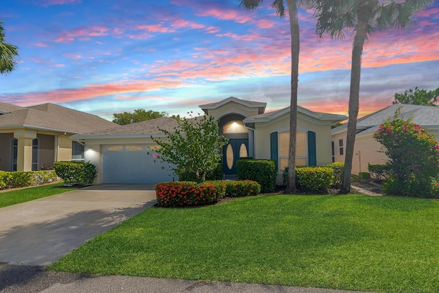 619 NW Monticello Pl, Port Saint Lucie, FL 34986 - ranch-style house with stucco siding, an attached garage, concrete driveway, and a yard