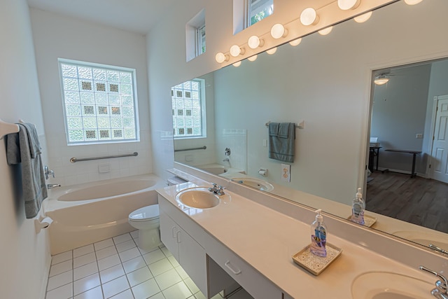 619 NW Monticello Pl, Port Saint Lucie, FL 34986 - bathroom featuring a bath, double vanity, and tile patterned flooring