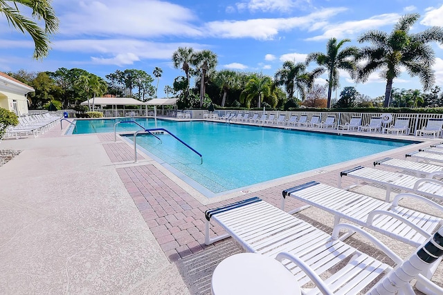 619 NW Monticello Pl, Port Saint Lucie, FL 34986 - community pool featuring a patio