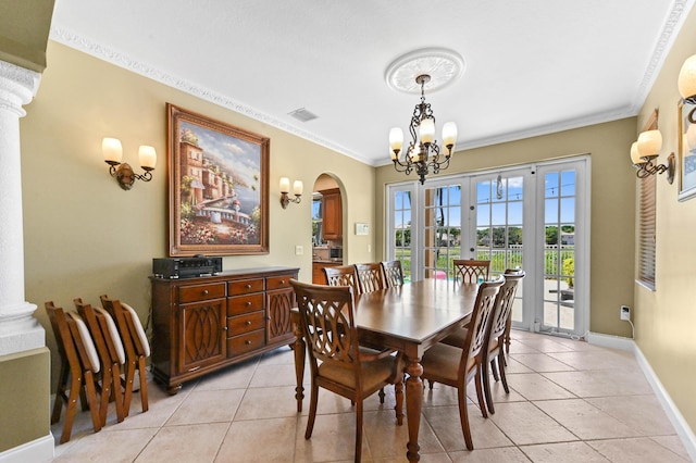 7486 Greenville Cir, Lake Worth, FL 33467 - dining space featuring a chandelier, crown molding, light tile patterned floors, arched walkways, and ornate columns