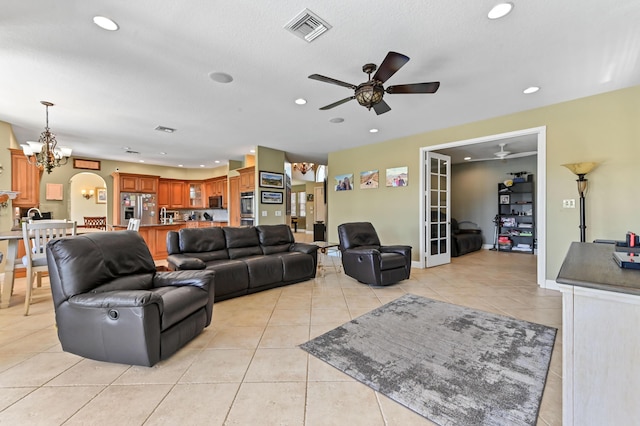 7486 Greenville Cir, Lake Worth, FL 33467 - living area with ceiling fan, recessed lighting, a chandelier, light tile patterned floors, and french doors