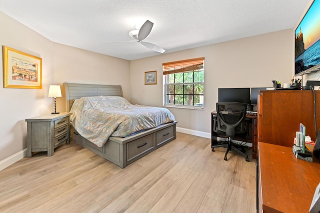 7486 Greenville Cir, Lake Worth, FL 33467 - bedroom with light wood-style floors, an office area, and a ceiling fan