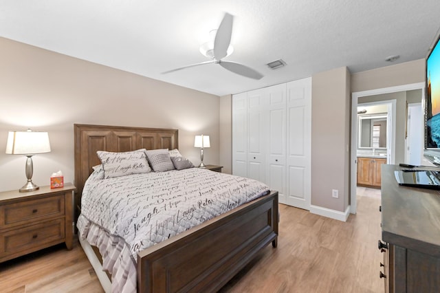 7486 Greenville Cir, Lake Worth, FL 33467 - bedroom with light wood-type flooring, a closet, and a ceiling fan