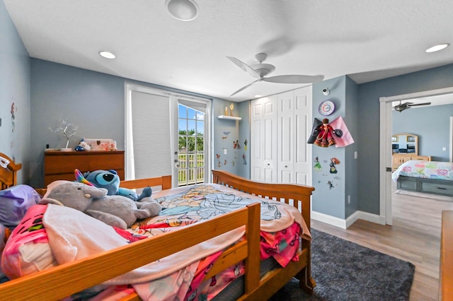 7486 Greenville Cir, Lake Worth, FL 33467 - bedroom featuring wood finished floors, access to exterior, a closet, ceiling fan, and recessed lighting
