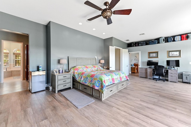 7486 Greenville Cir, Lake Worth, FL 33467 - bedroom featuring a desk, light wood-type flooring, connected bathroom, and ceiling fan