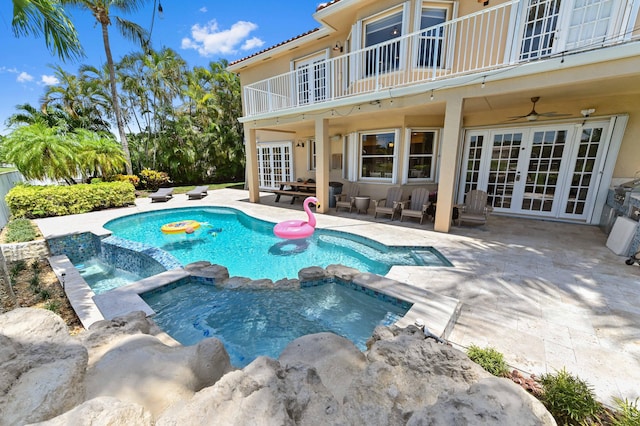 7486 Greenville Cir, Lake Worth, FL 33467 - view of swimming pool with french doors, a pool with connected hot tub, a patio, and ceiling fan