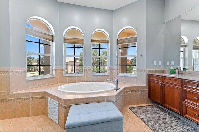 7486 Greenville Cir, Lake Worth, FL 33467 - bathroom with vanity, a whirlpool tub, tile patterned flooring, plenty of natural light, and a high ceiling