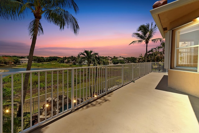7486 Greenville Cir, Lake Worth, FL 33467 - balcony at dusk featuring a water view