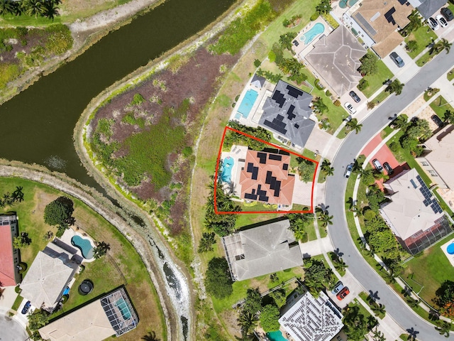 7486 Greenville Cir, Lake Worth, FL 33467 - aerial view of residential area with a nearby body of water and property parcel outlined