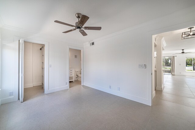 815 W Boynton Beach Blvd Unit 12-106, Boynton Beach, FL 33426 - unfurnished bedroom with ornamental molding, a walk in closet, ceiling fan, and ensuite bathroom