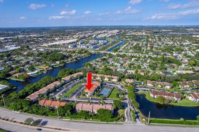 815 W Boynton Beach Blvd Unit 12-106, Boynton Beach, FL 33426 - aerial view of property and surrounding area featuring a nearby body of water and nearby suburban area