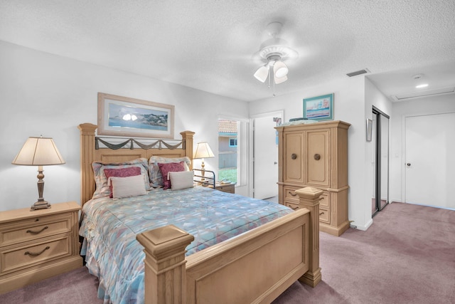 9976 Seacrest Cir Unit D, Boynton Beach, FL 33437 - bedroom featuring light carpet, a textured ceiling, and ceiling fan