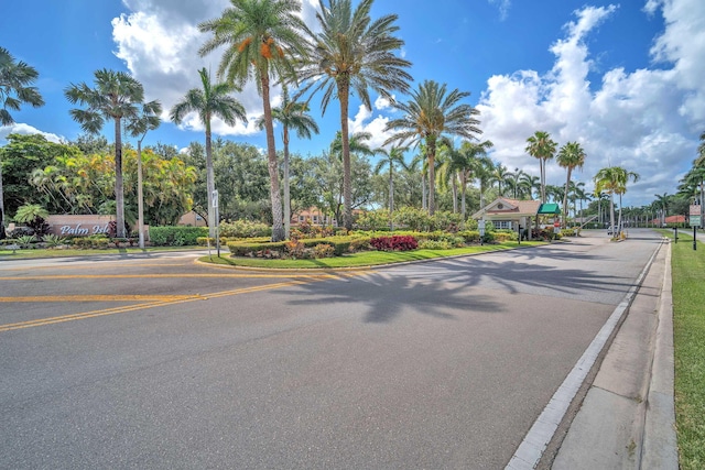 9976 Seacrest Cir Unit D, Boynton Beach, FL 33437 - view of asphalt road featuring curbs and traffic signs