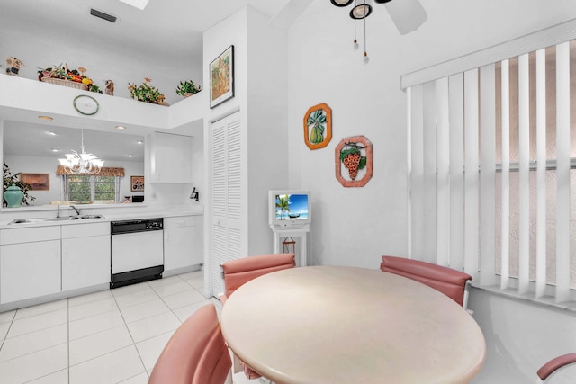 9976 Seacrest Cir Unit D, Boynton Beach, FL 33437 - dining space featuring a chandelier, light tile patterned floors, a towering ceiling, and a ceiling fan