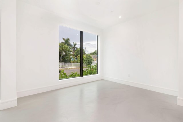 1921 Dock St, West Palm Beach, FL 33401 - empty room with finished concrete flooring and recessed lighting