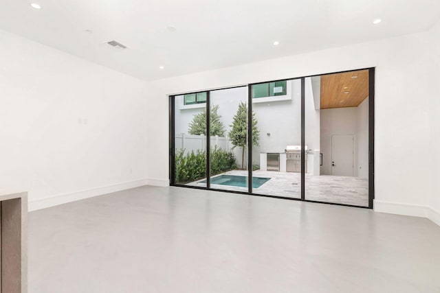 1921 Dock St, West Palm Beach, FL 33401 - empty room featuring concrete flooring and recessed lighting