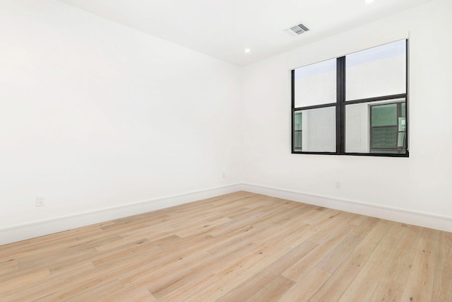 1921 Dock St, West Palm Beach, FL 33401 - spare room featuring wood finished floors and recessed lighting