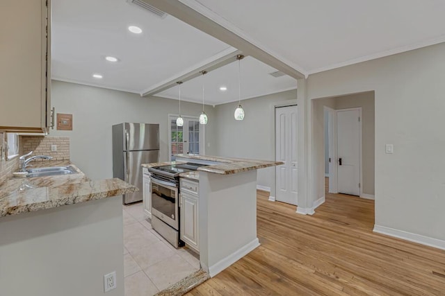 720 N Ocean Breeze, Lake Worth Beach, FL 33460 - kitchen with stainless steel appliances, light stone counters, crown molding, recessed lighting, and hanging light fixtures