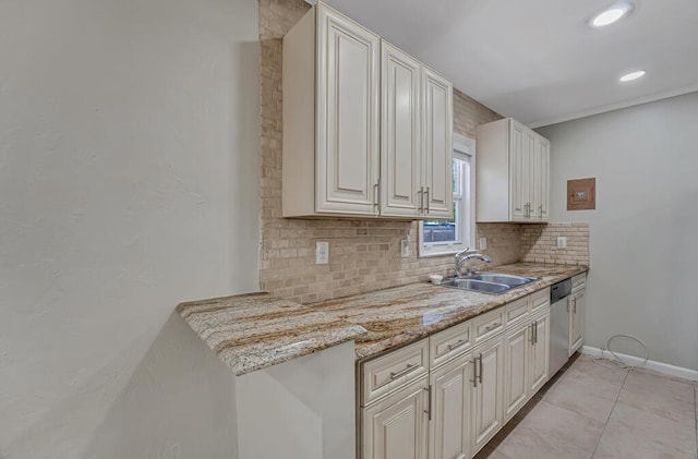 720 N Ocean Breeze, Lake Worth Beach, FL 33460 - kitchen featuring tasteful backsplash, dishwasher, light tile patterned floors, light stone counters, and white cabinets
