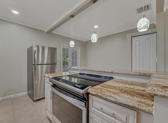 720 N Ocean Breeze, Lake Worth Beach, FL 33460 - kitchen with stainless steel appliances, crown molding, light stone counters, decorative light fixtures, and french doors