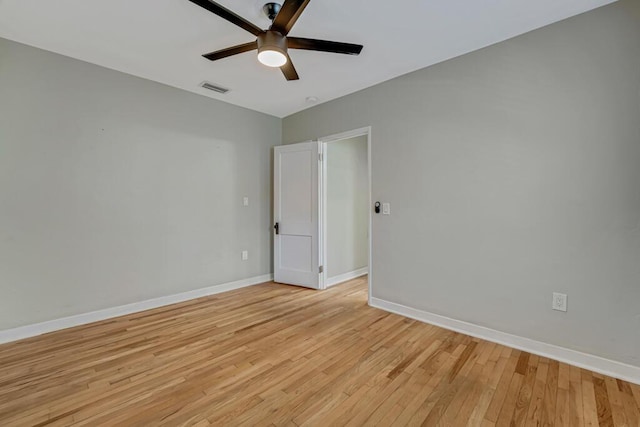 720 N Ocean Breeze, Lake Worth Beach, FL 33460 - empty room with a ceiling fan and light wood-style flooring