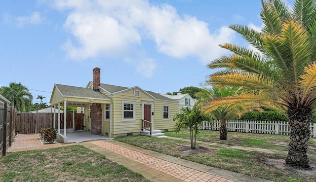720 N Ocean Breeze, Lake Worth Beach, FL 33460 - bungalow-style house with a chimney