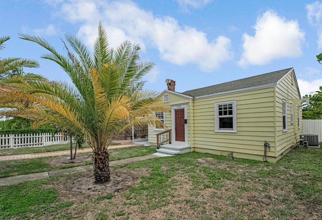 720 N Ocean Breeze, Lake Worth Beach, FL 33460 - view of front facade with a chimney
