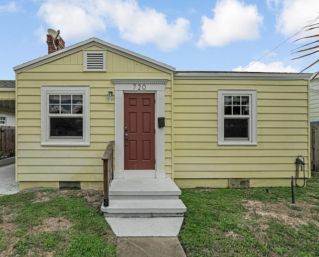720 N Ocean Breeze, Lake Worth Beach, FL 33460 - view of front of home with crawl space and a chimney