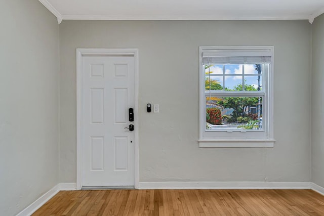720 N Ocean Breeze, Lake Worth Beach, FL 33460 - entrance foyer featuring light wood finished floors and crown molding