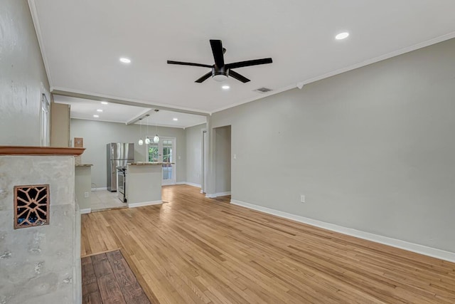 720 N Ocean Breeze, Lake Worth Beach, FL 33460 - unfurnished living room with ceiling fan, crown molding, recessed lighting, and light wood-type flooring