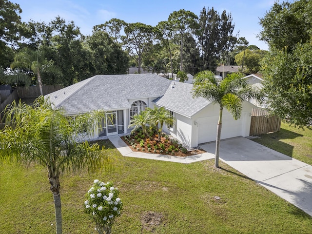 1633 SE Clearmont St, Port Saint Lucie, FL 34983 - ranch-style home with a shingled roof, a garage, driveway, and stucco siding