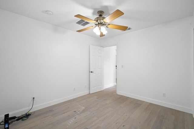 1633 SE Clearmont St, Port Saint Lucie, FL 34983 - empty room with a smoke detector, light wood-style flooring, and ceiling fan