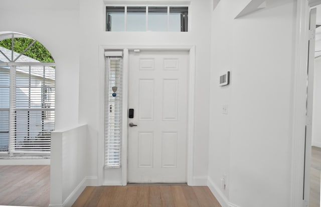 1633 SE Clearmont St, Port Saint Lucie, FL 34983 - entrance foyer with wood finished floors and baseboards