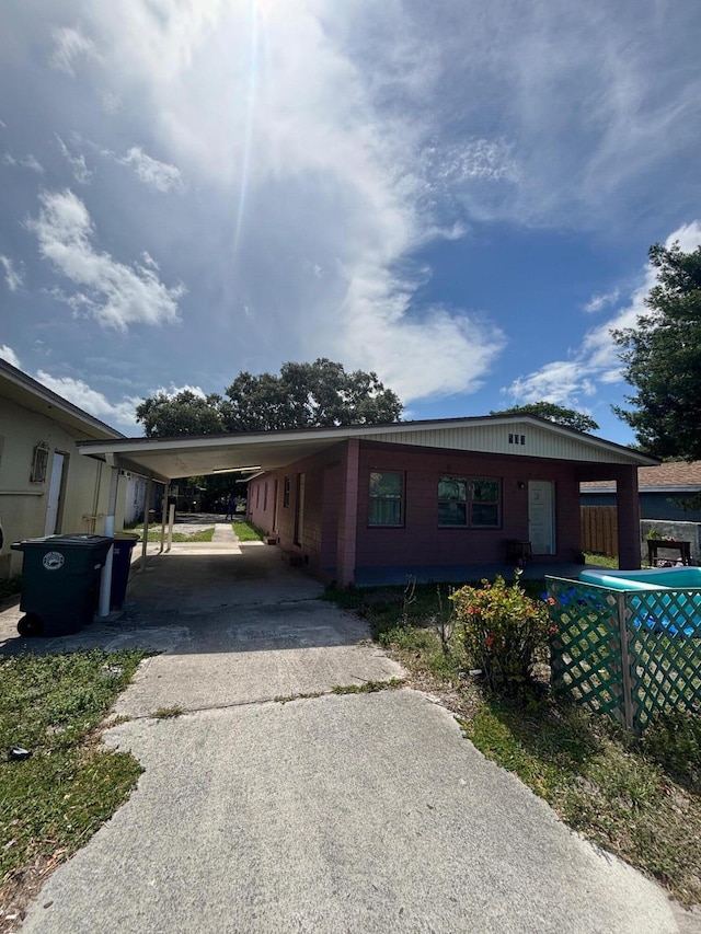 503 N 25th St, Fort Pierce, FL 34947 - view of front of property with driveway and an attached carport