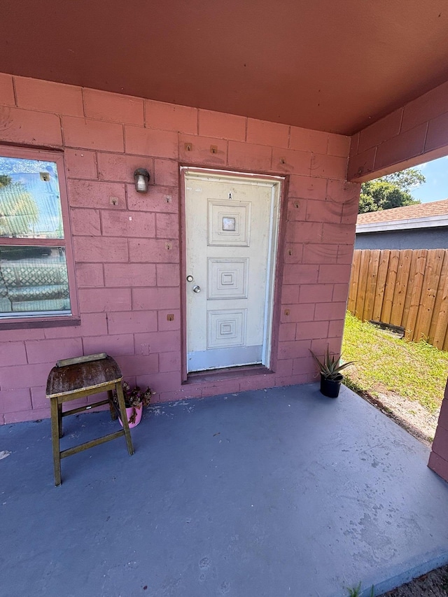 503 N 25th St, Fort Pierce, FL 34947 - view of exterior entry with concrete block siding