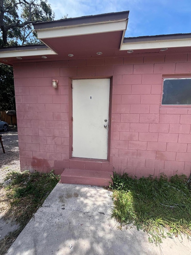 503 N 25th St, Fort Pierce, FL 34947 - doorway to property with concrete block siding