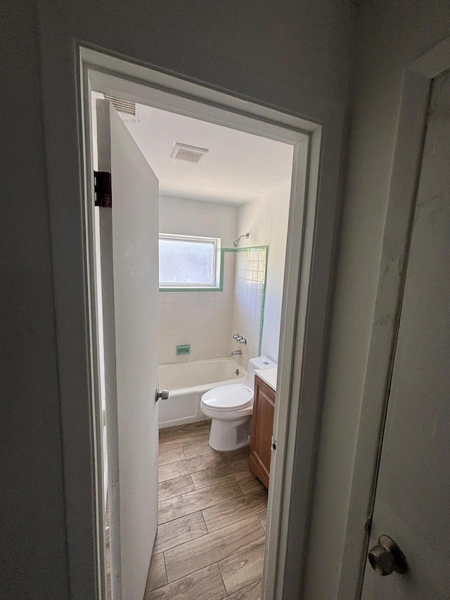 503 N 25th St, Fort Pierce, FL 34947 - bathroom with vanity, bathing tub / shower combination, and wood finished floors