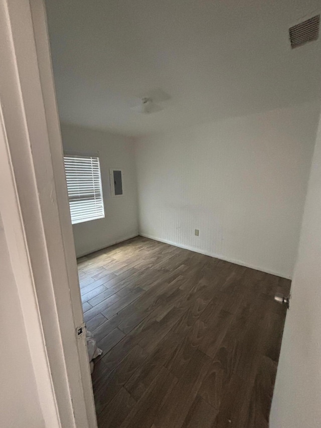 503 N 25th St, Fort Pierce, FL 34947 - spare room with dark wood finished floors and electric panel