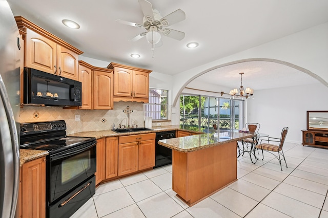 7 Greenway N Unit 111, Royal Palm Beach, FL 33411 - kitchen featuring black appliances, arched walkways, tasteful backsplash, a chandelier, and light stone counters