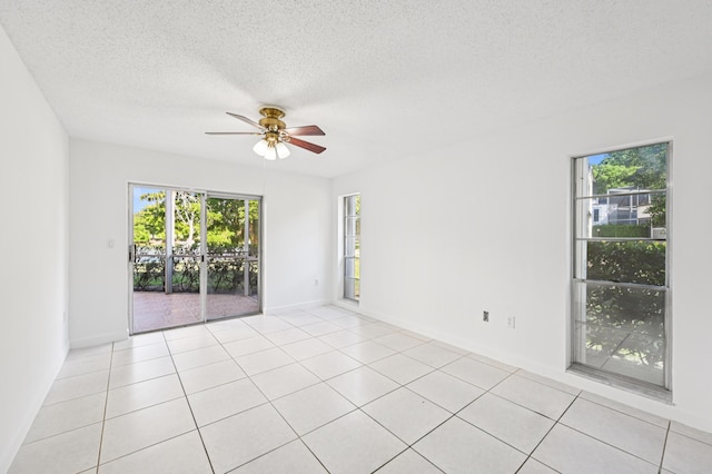 7 Greenway N Unit 111, Royal Palm Beach, FL 33411 - unfurnished room with a ceiling fan, a textured ceiling, and light tile patterned floors