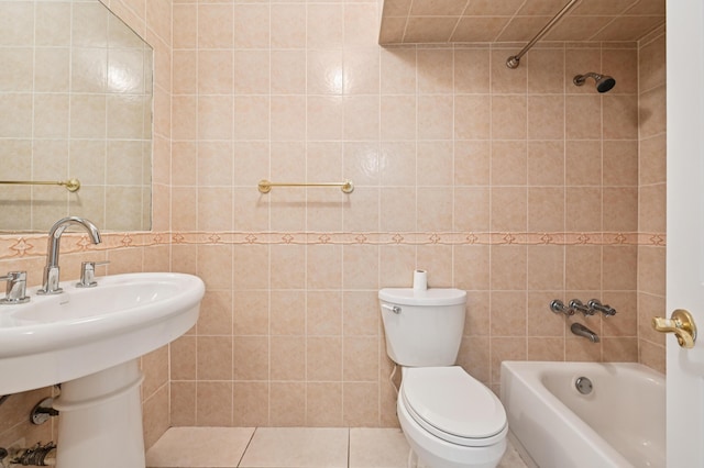 7 Greenway N Unit 111, Royal Palm Beach, FL 33411 - bathroom with tile walls, shower / bathtub combination, and tile patterned flooring