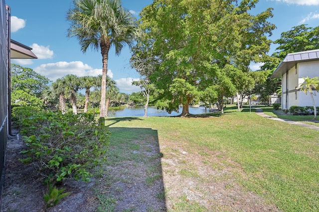7 Greenway N Unit 111, Royal Palm Beach, FL 33411 - view of green lawn with a water view