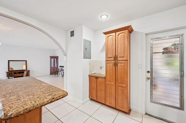 7 Greenway N Unit 111, Royal Palm Beach, FL 33411 - entryway featuring arched walkways, electric panel, light tile patterned flooring, and recessed lighting